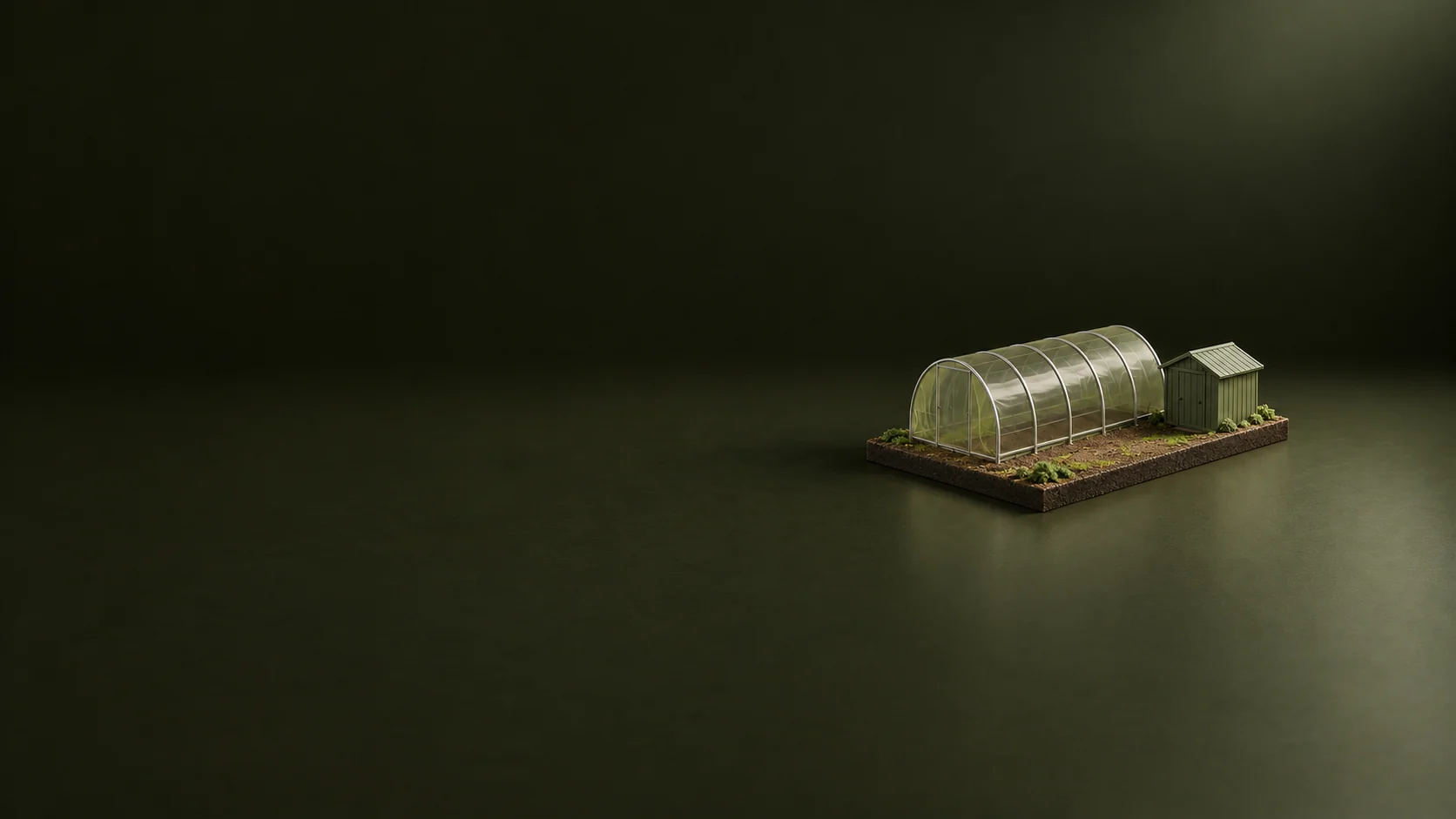 A scale model of a greenhouse and small utility shed on a complete rectangular site base.