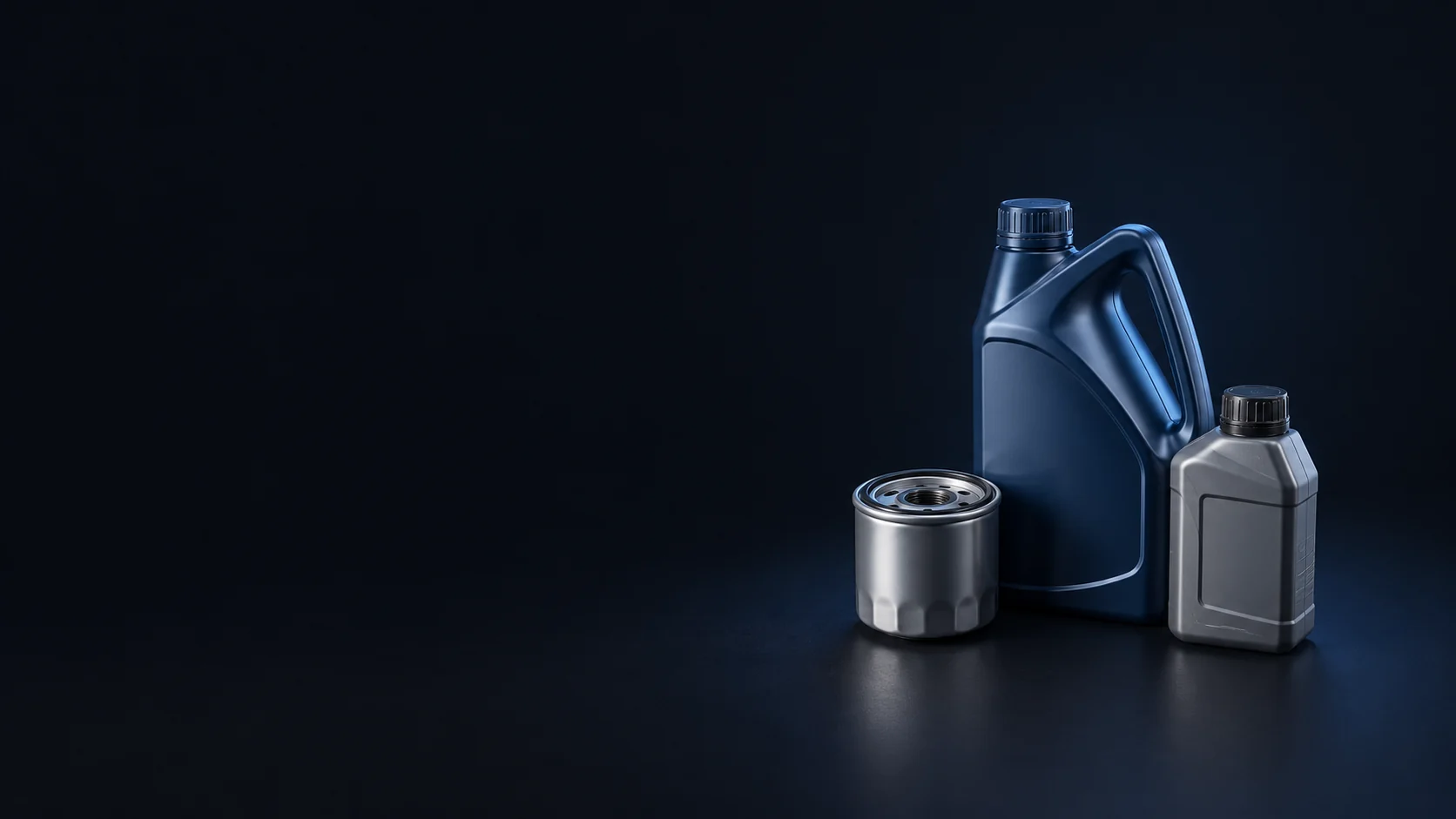Sealed blue and grey fluid bottles beside a clean silver spin-on filter on a dark surface.