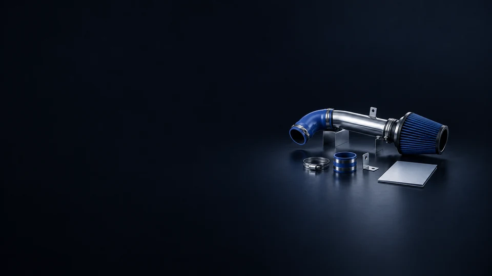 A silver intake tube with blue elbow and cone filter on supports, with separate clamps, a coupler, bracket and blank sleeve.