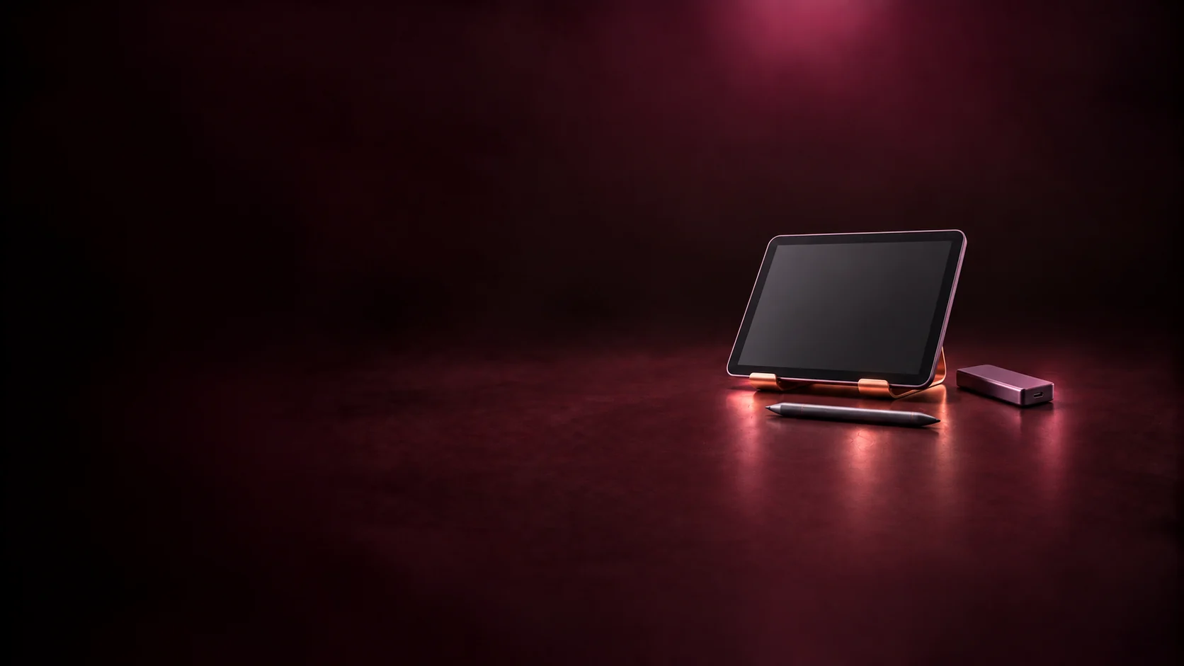 A tablet with an inactive screen, stylus and portable drive.