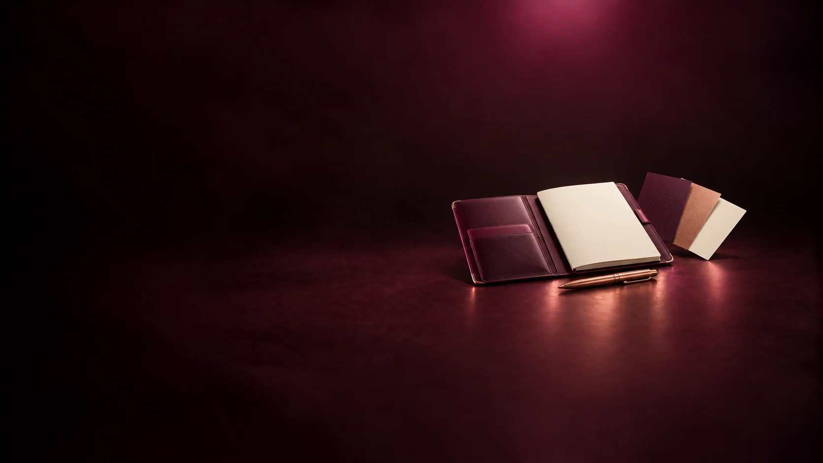 An open leather portfolio with blank pages and material swatches.