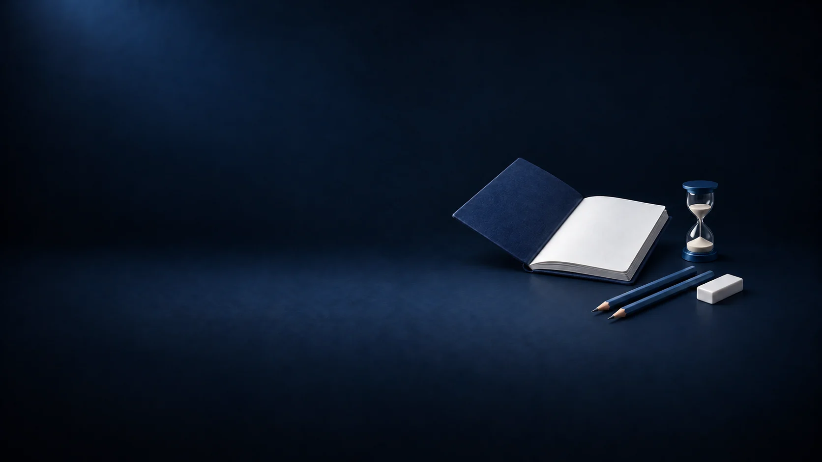 A blank navy practice book, a glass sand timer, two blue pencils and a white eraser.