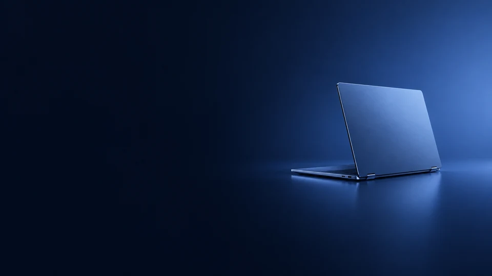 Blue aluminum laptop shown from the rear with its lid open.