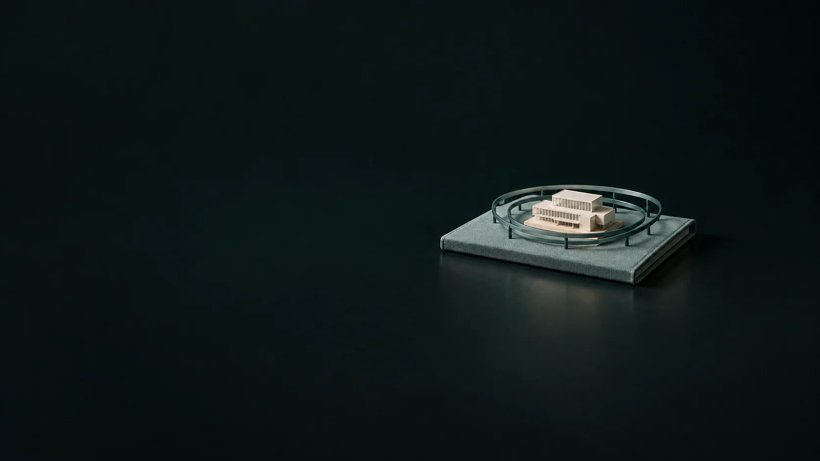 A small office model within teal oval boundary frames on a closed briefing folder.