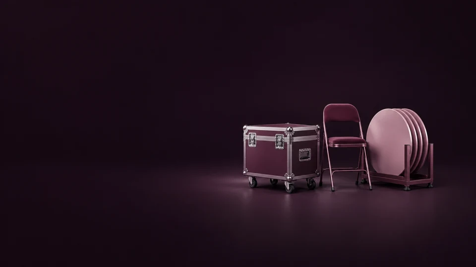 A wheeled road case, folding event chair and round tabletops in a storage cradle.