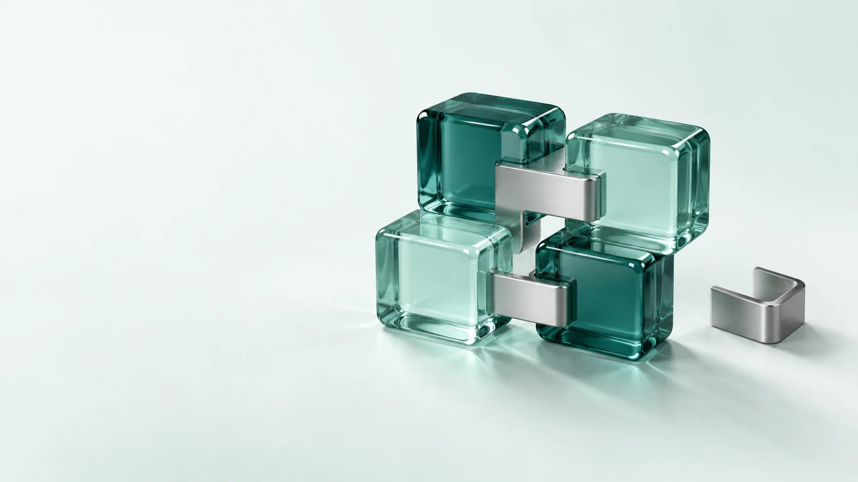 Teal glass blocks linked by silver bridges beside a separated connector.