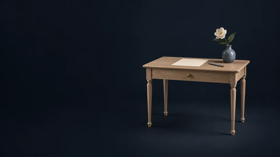 Oak arrangement desk with a blank paper, capped pen and one white flower in a small blue vase.