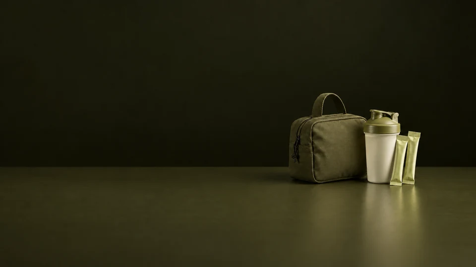 An olive training pouch, ivory shaker and two sealed pale olive stick packs.