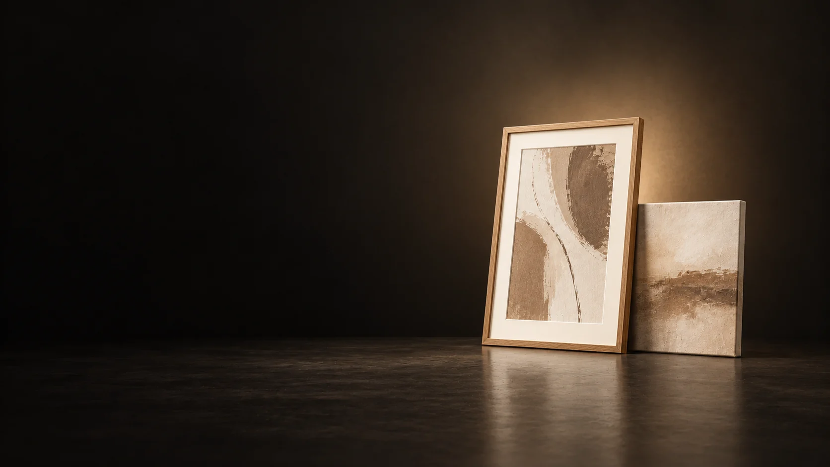 Oak-framed abstract print beside a smaller unframed textured canvas.