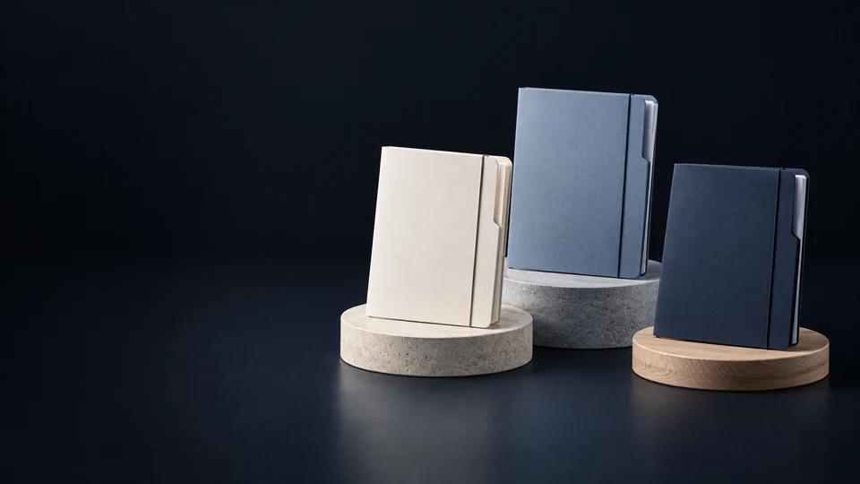 Three blank court-stage folders on separate low round plinths.