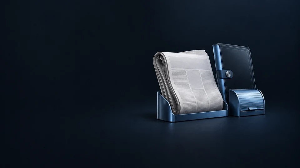 A folded newspaper in a metal doorstep cradle beside a glass reading folio and closed delivery shutter.