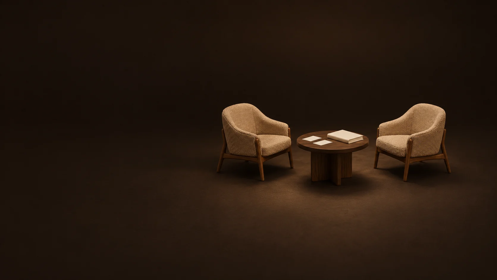 Two empty camel chairs around an oak table with paired blank cards and a closed workbook.