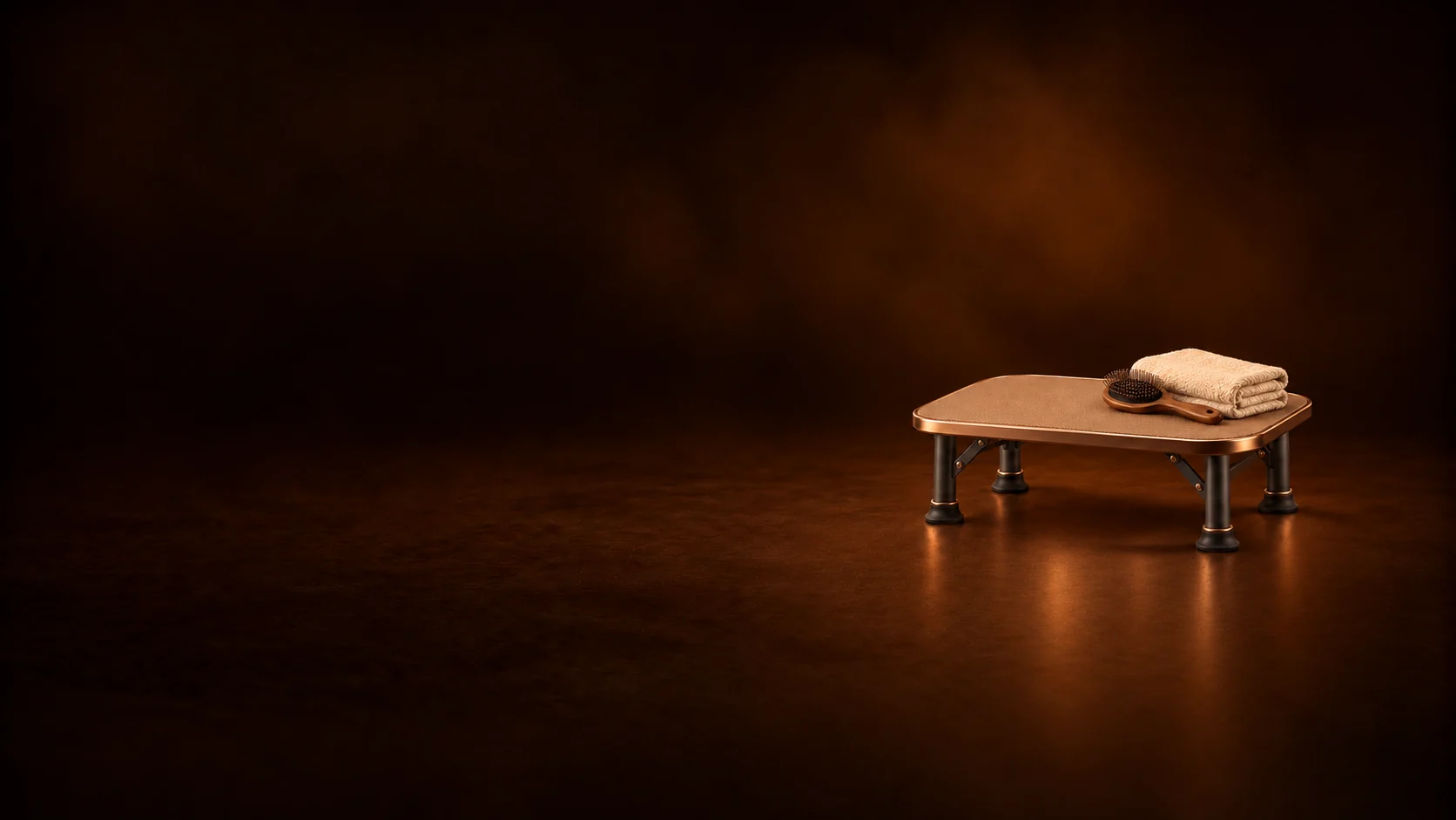 Empty compact grooming table with a folded towel and a wooden grooming brush.