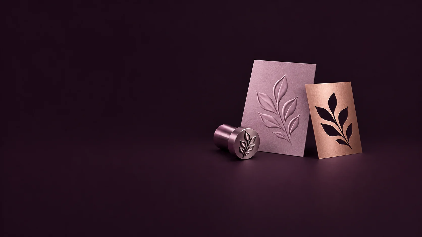 An embossed orchid leaf card stands beside a copper cutout mask and a matching metal embossing die.