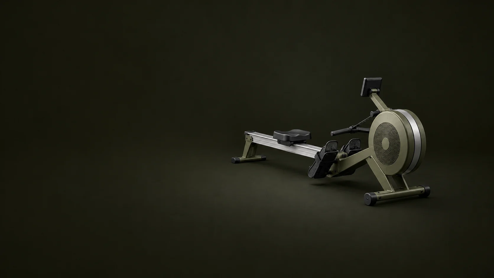A complete olive rowing machine shows its flywheel, rail, sliding seat, footplates and blank monitor.