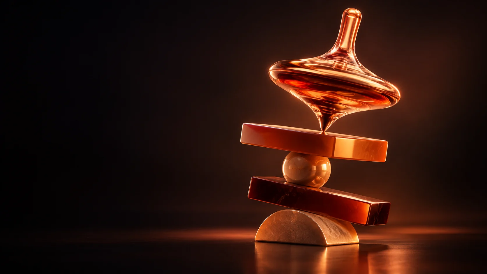 An orange glass spinning top above amber blocks and a sphere on a curved stone base.