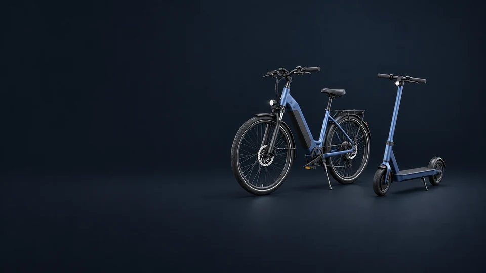 An electric bicycle with pedals and a standing electric kick scooter.