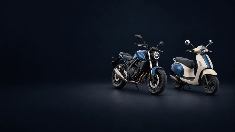 A blue road motorcycle and an ivory seated motor scooter parked on stands.